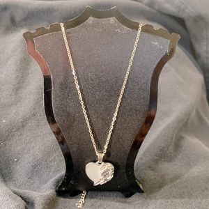 Woman’s silver heart pendant